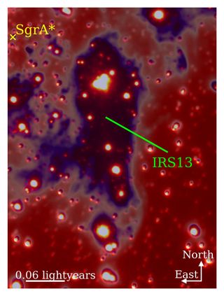 A large purple blob with glowing red and orange spheres inside